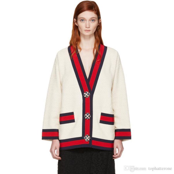 White and red cardigan sweater with black midi skirt