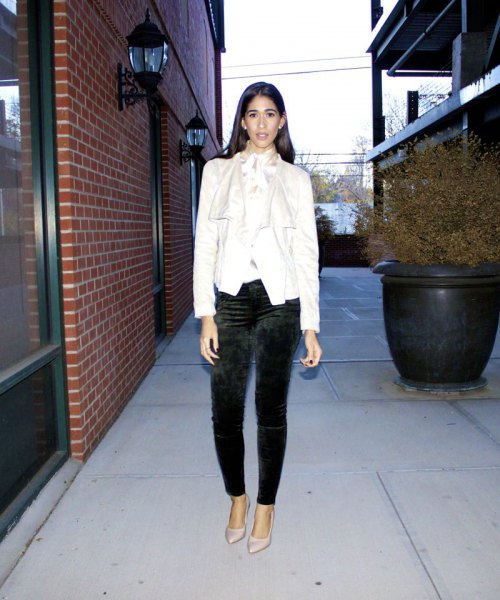 White blazer with black slim fit pants and pointed heels