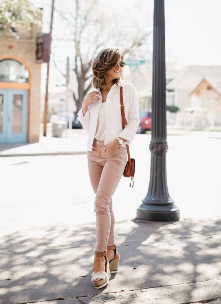 White blazer paired with blush skinny jeans and light pink open toe platform heels
