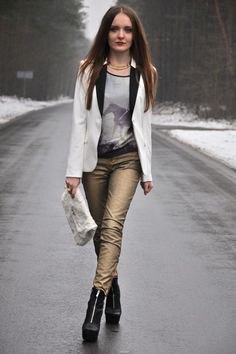White blazer with gray printed scoop neck t-shirt and gold pants
