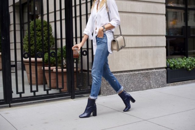 White button down blouse, cuffed jeans and navy heeled ankle boots