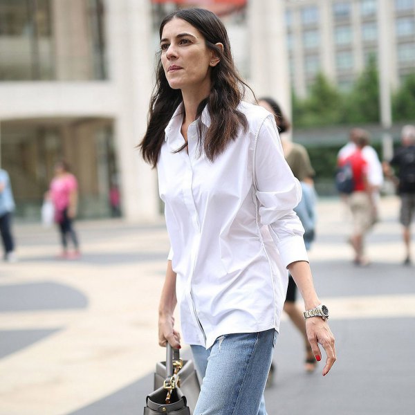 White oversized formal button down shirt and blue straight leg jeans
