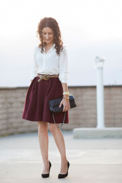 White button down shirt and belted mini skater skirt
