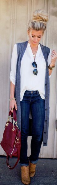 White button down shirt, long sleeveless cardigan and brown boots
