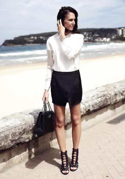White button down shirt, skort and black lace up sandals