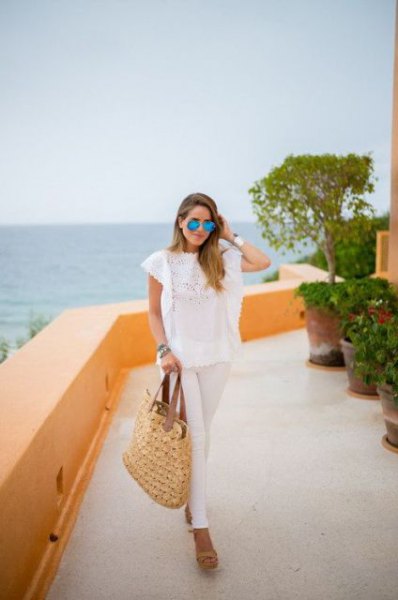 White lace top with cap sleeves and straw bag