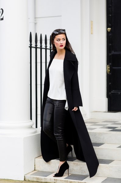 white chiffon blouse with black leather leggings and maxi coat