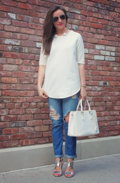 White chiffon blouse with blue boyfriend jeans with ripped knees