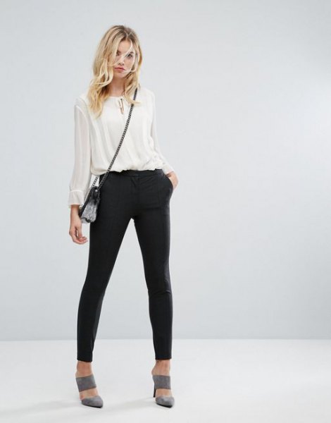 White, semi-transparent chiffon blouse with black sweatpants and gray heels