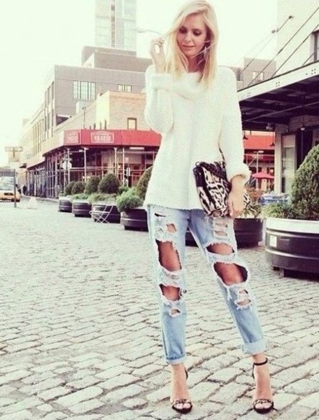 White chunky knit sweater with light blue ripped boyfriend
jeans