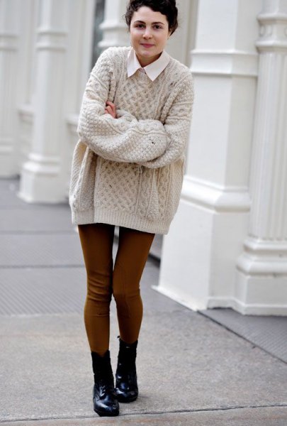 White collared shirt and light pink cable knit sweater
