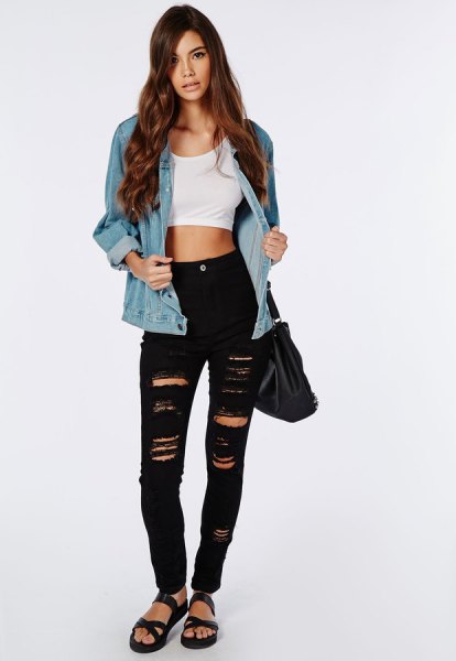 White crop top worn with blue denim jacket and ripped black skinny jeans