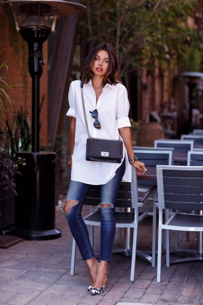 White buttoned tunic shirt and ripped ankle jeans