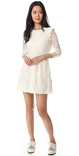 White lace flared mini dress with wingtip shoes