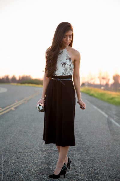 White floral halter top and black high rise midi skirt