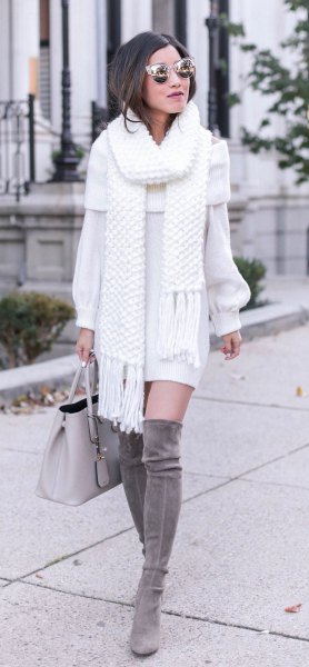 white fringed scarf with matching sweater dress and gray thigh high boots