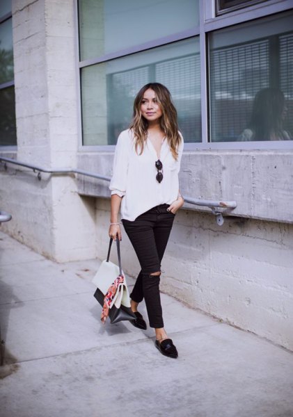 White blouse with half sleeves, relaxed fit, black ripped slim fit jeans and loafers