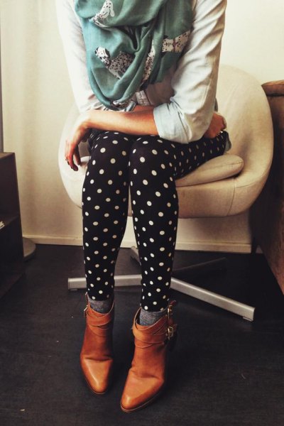 white hoodie with polka dot leggings and brown leather boots