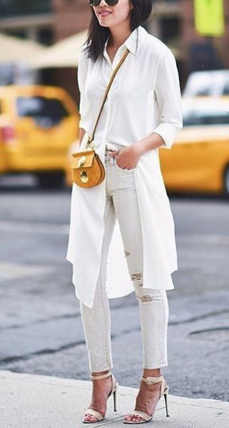 White knee length long sleeve blouse with ripped ankle jeans