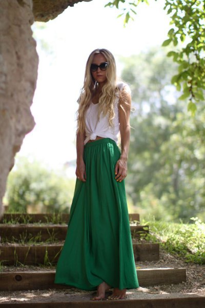 White knotted sleeveless t-shirt with green flared maxi skirt