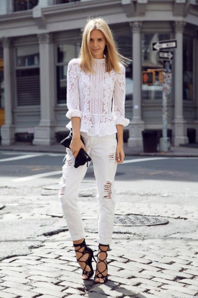 White lace blouse with ripped slim fit jeans and strappy heeled sandals