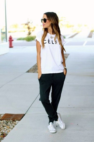 White logo t-shirt with black jogger jeans and sneakers