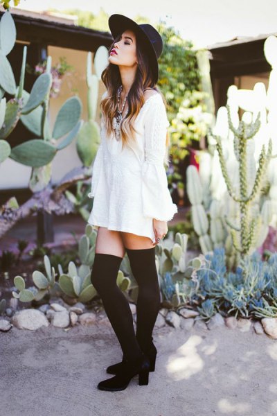 White long sleeve shirt dress with thigh high tights and heeled ankle boots