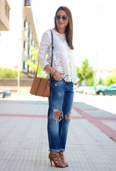 White long sleeve blouse with ripped jeans and red strappy lace-up
sandals