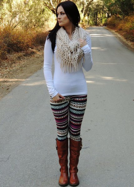 White long sleeve bodycon t-shirt with tribal print leggings and brown boots