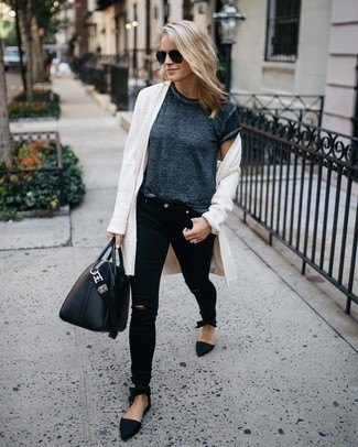 White long cardigan with mottled gray short-sleeved t-shirt and black jeans