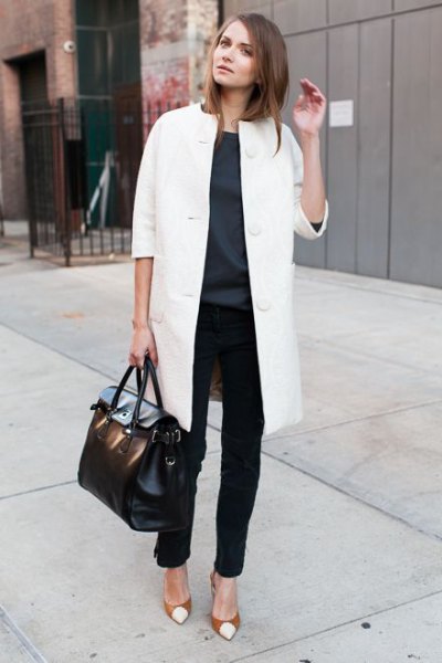 white long wool coat with black chinos and red cap-toe heels