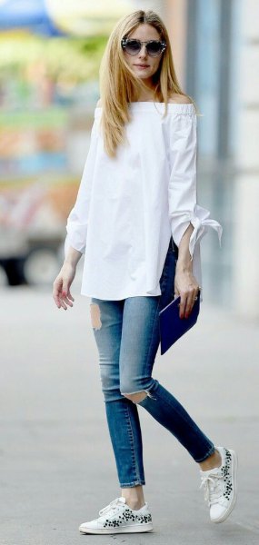 White off shoulder long blouse with ripped ankle jeans
