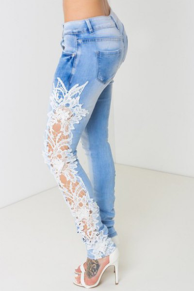 White open heels with light blue high waist jeans