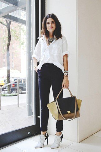 White oversized shirt with high rise dress pants and light gray heeled boots