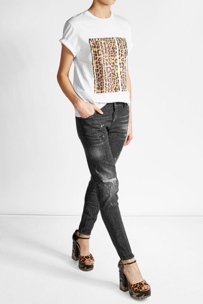 White printed t-shirt with black slim fit biker jeans