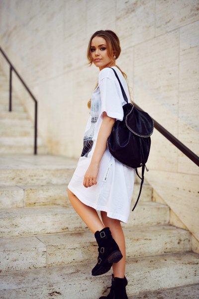 White printed t-shirt dress with velvet ankle boots and backpack handbag