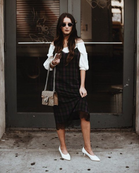 White off the shoulder puff sleeve blouse and black and burgundy plaid shift dress