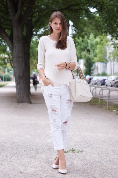 White scoop neck sweater and matching boyfriend jeans with ripped cuffs