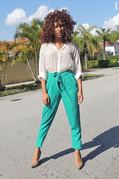 White semi-sheer blouse with gray high-waisted cropped chinos