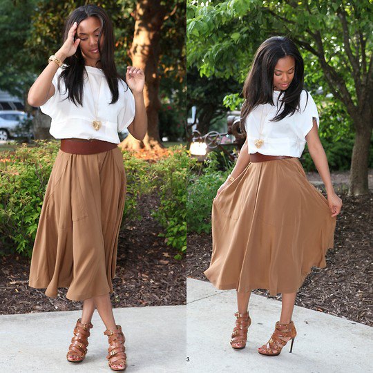 White short sleeve blouse with a green flared midi skirt