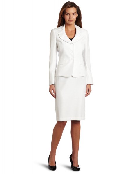 White suit jacket with knee length straight dress and black heels