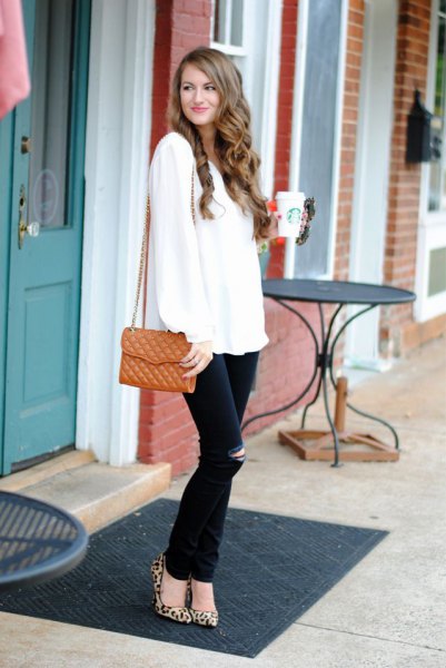 White sweater with black ripped jeans and leopard heels