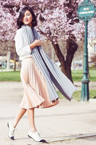 White sweatshirt with pale pink pleated midi dress and oxford
shoes