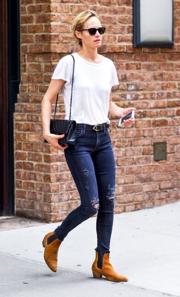 White t-shirt with blue skinny jeans and tan leather boots