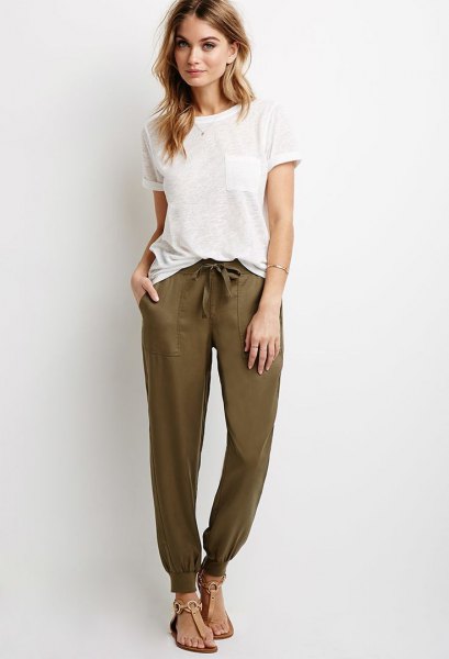 White t-shirt with olive sweatpants and sandals