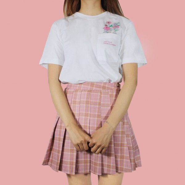 White t-shirt with pink pleated skirt