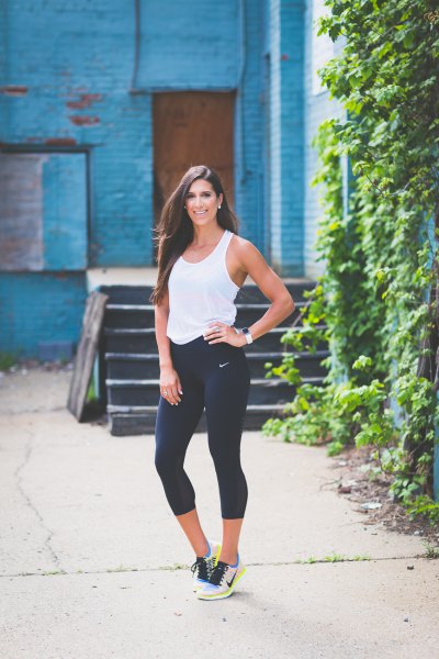 White tank top with black, short running tights
