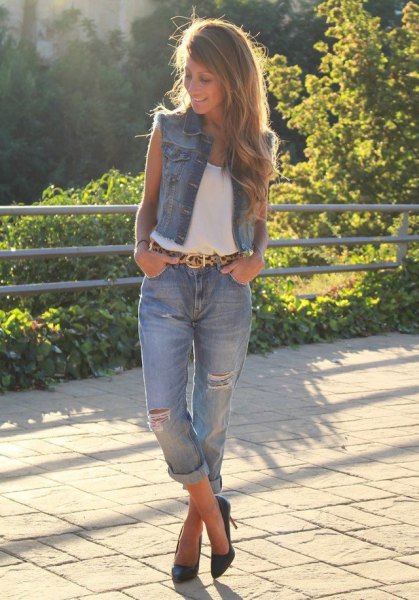 White tank top with blue ripped cuffed boyfriend jeans