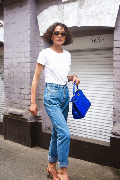 White t-shirt with mom jeans and blue handbag