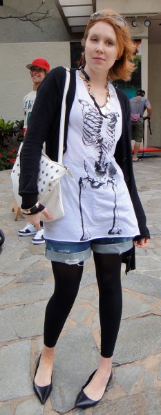 White tunic graphic t-shirt with denim shorts and black footless tights